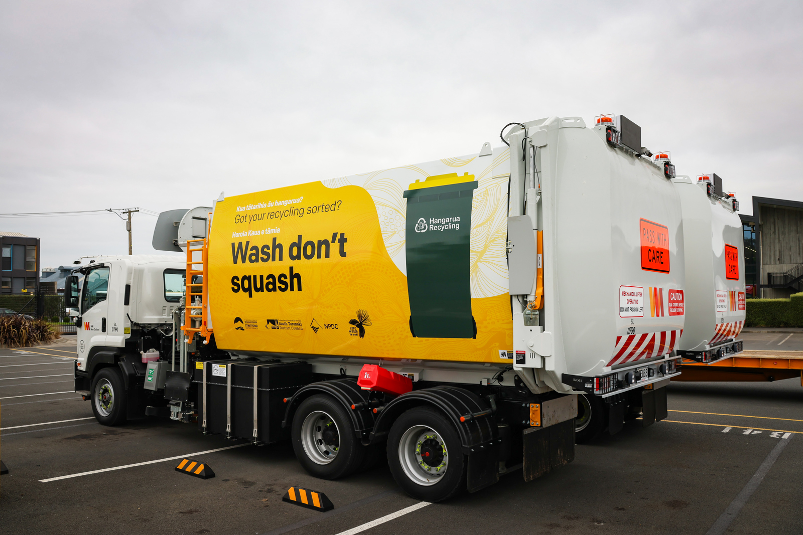 Rubbish truck picking up yellow bin
