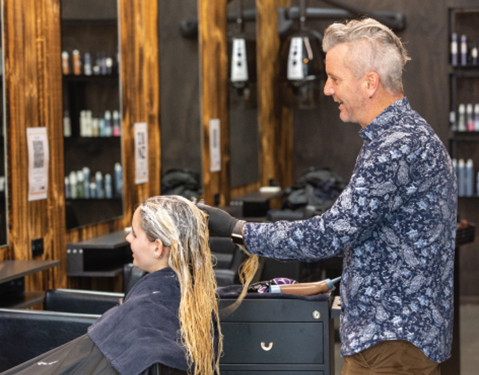 Male hair dresser at work