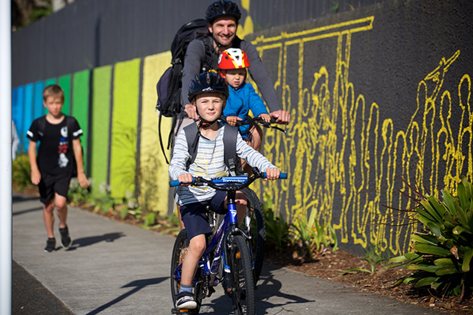 Family riding their bikes to school