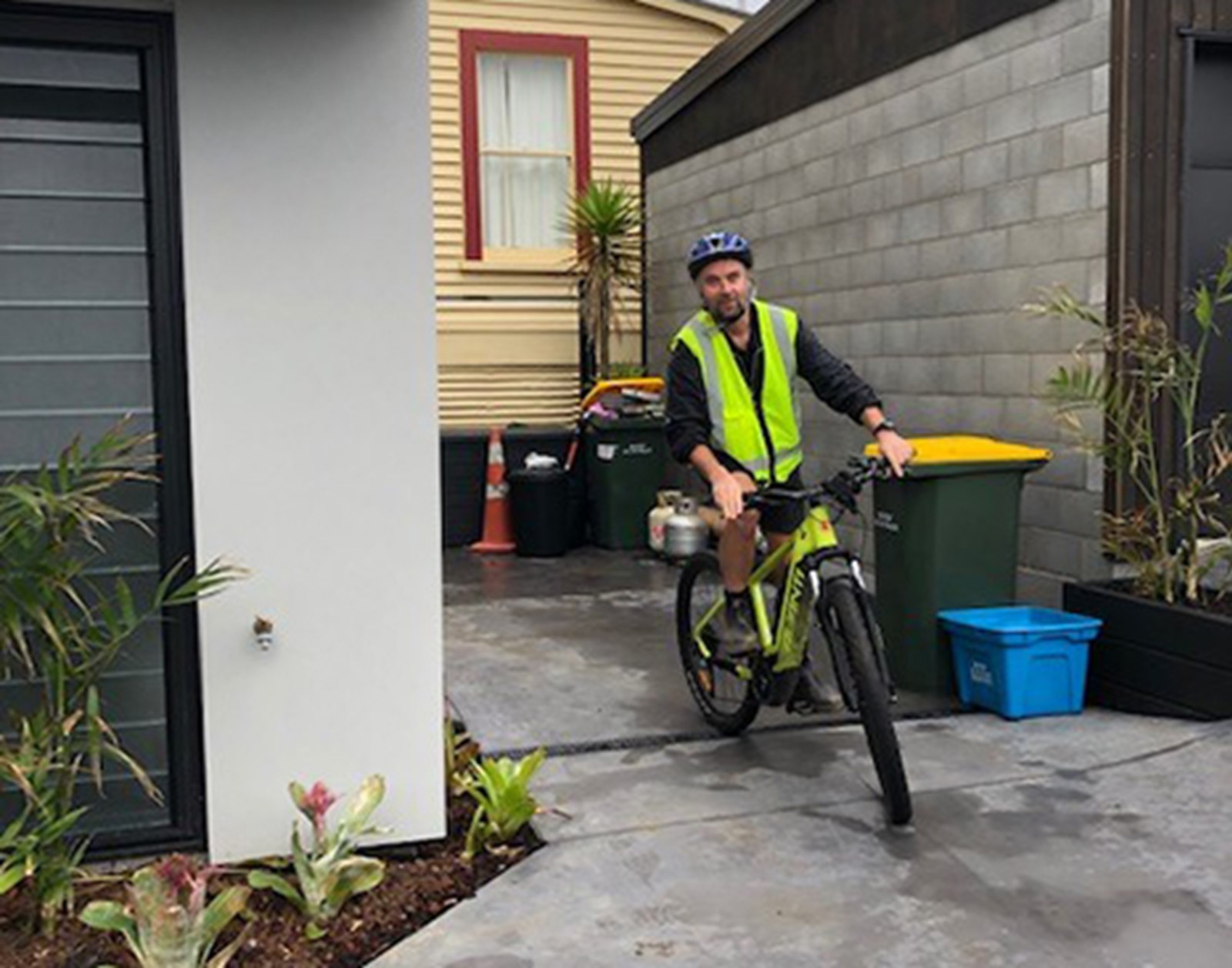 Man leaving the house on a bike