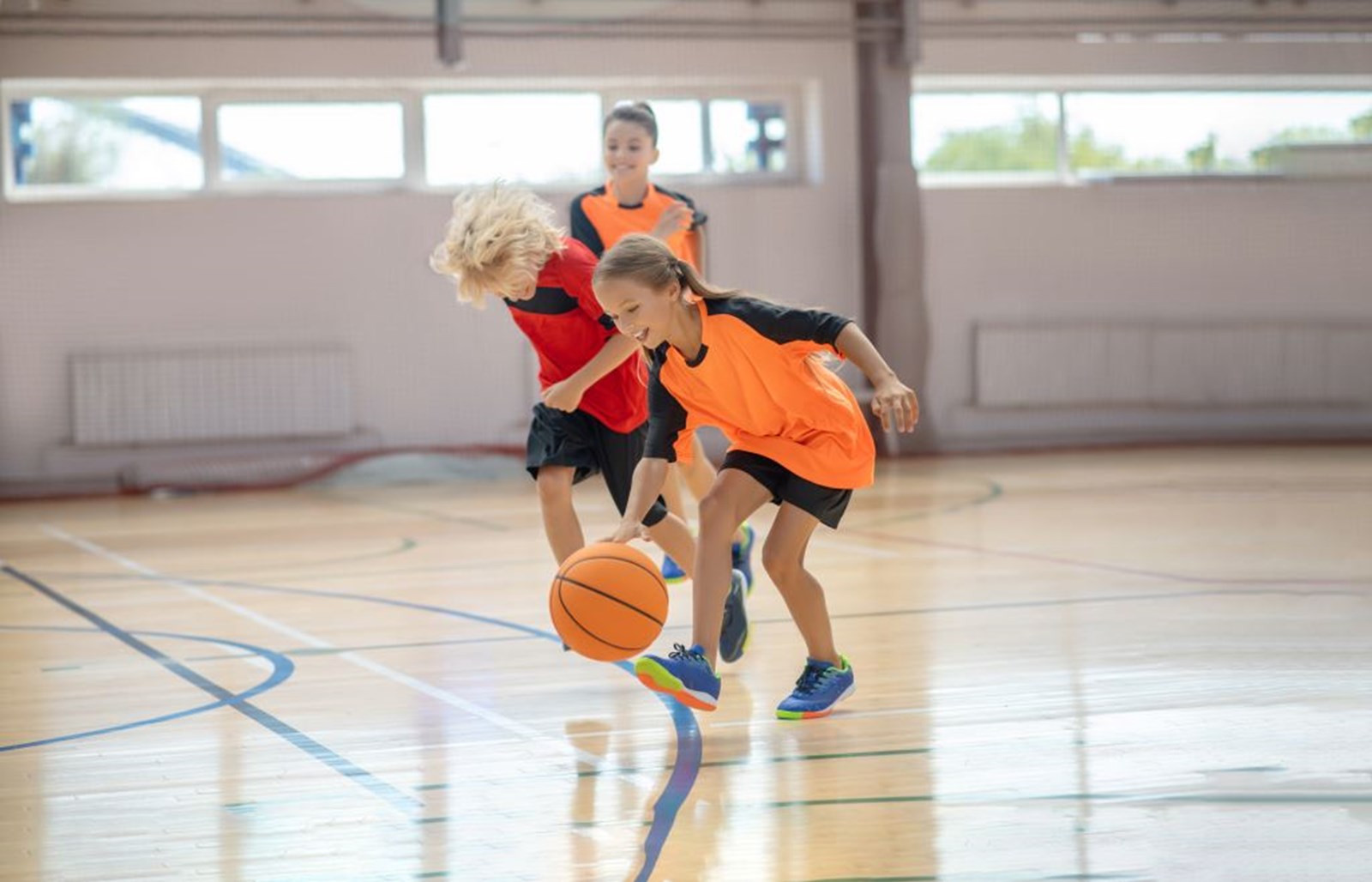 Children playing basketball. 