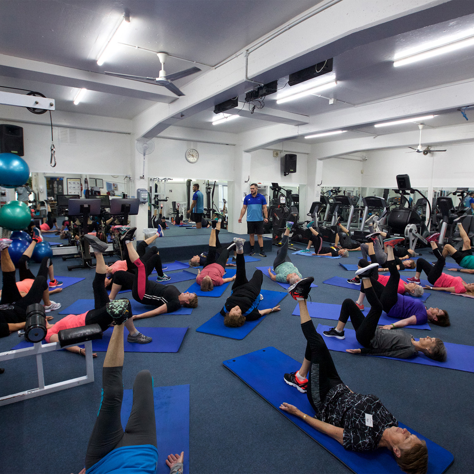 People exercising in 50s Forward gym class.