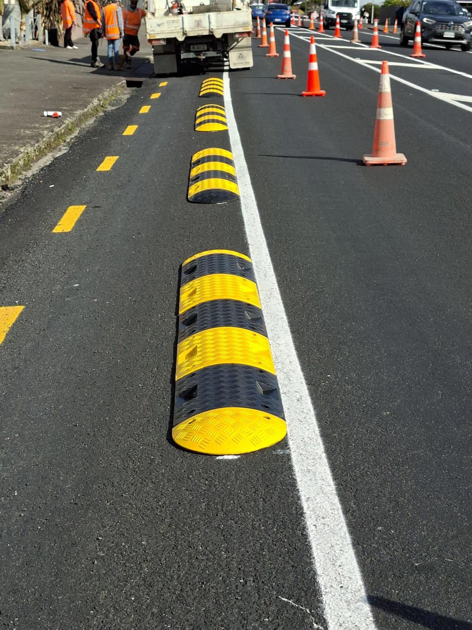 Black and yellow rubber separators on Devon Street West. 