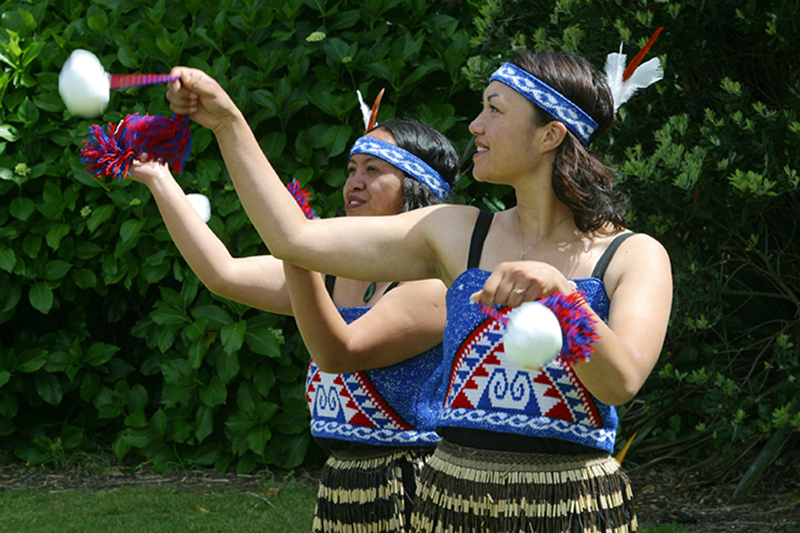 Two women using poi